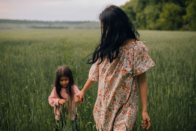 Mother and daughter on field