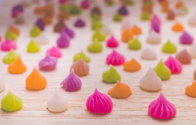 Close-up of multi colored candies on table