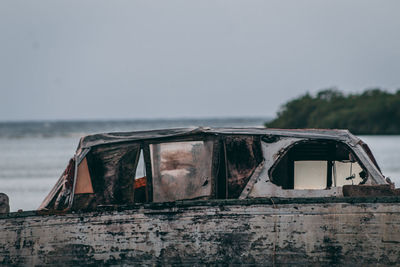 Abandoned boat against clear sky