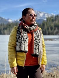 Portrait of smiling woman standing in water