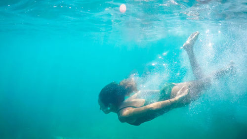 Man swimming in sea