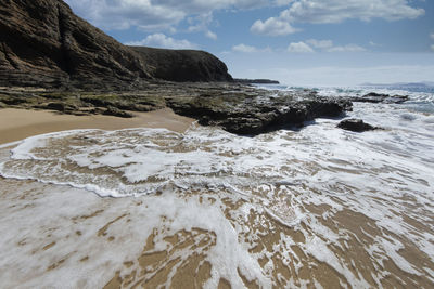 Waves washing ashore at playa de mujeres in the south of lanzarote