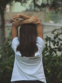 Rear view of woman standing outdoors