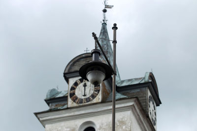 Low angle view of clock tower against sky