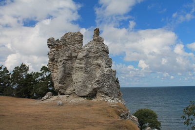 Scenic view of sea against cloudy sky