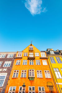 Low angle view of building against blue sky