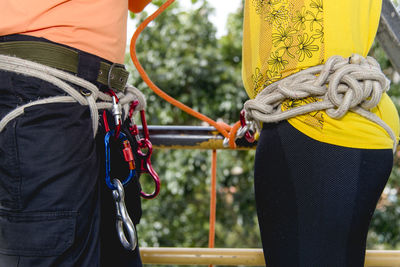 Rappel practitioners preparing the equipment to perform the activity next. salvador bahia brazil.