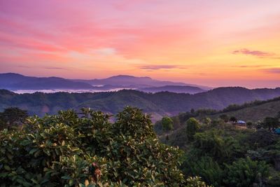 Scenic view of mountains against sky during sunset