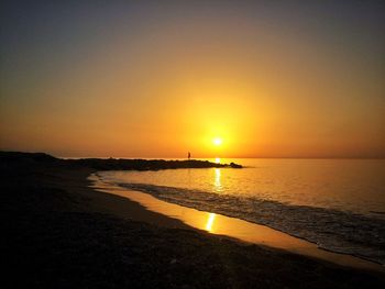 Scenic view of beach during sunset