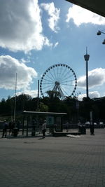 Ferris wheel against sky in city