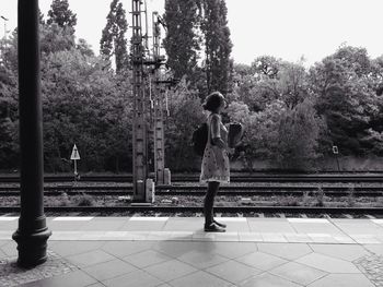 Woman walking on footpath