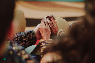 Midsection of woman holding hands