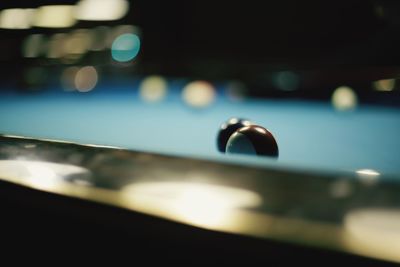 Defocused image of illuminated lights on table