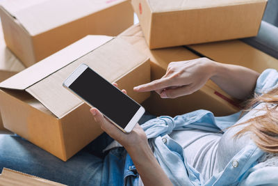 High angle view of woman using mobile phone