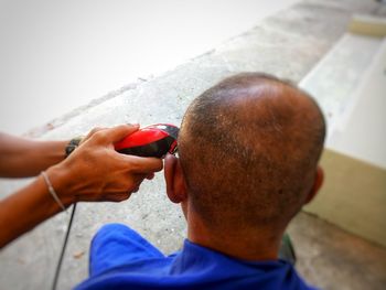 Close-up portrait of man holding cigarette