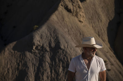 Adult man in cowboy hat in desert. almeria, spain