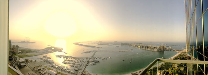 Panoramic view of cityscape against sky during sunset