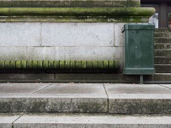 View of staircase and trashcan