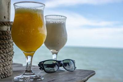Cocktails and sunglasses at the beach in mui ne, vietnam