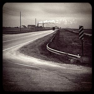 Empty road along landscape