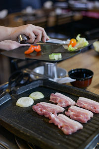 Midsection of man preparing food in kitchen