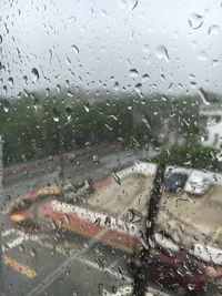 Full frame shot of wet glass window in rainy season