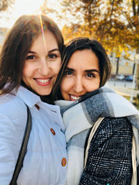Portrait of smiling young women in fall