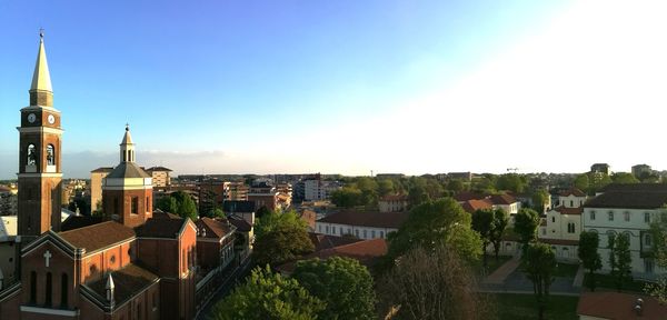 High angle shot of townscape against blue sky