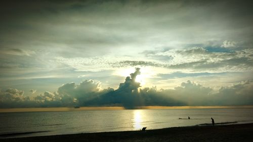 Scenic view of sea against sky at sunset