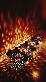 High angle view of butterfly on illuminated leaf