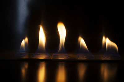 Close-up of burning candles