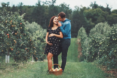 Full length of couple standing on land