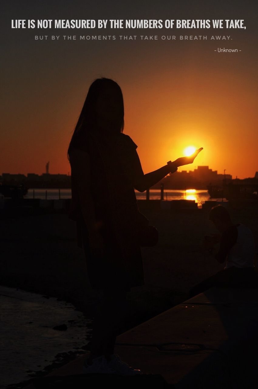 sunset, silhouette, real people, beach, sea, rear view, nature, sky, leisure activity, men, lifestyles, scenics, beauty in nature, water, standing, outdoors, one person, women, full length, people