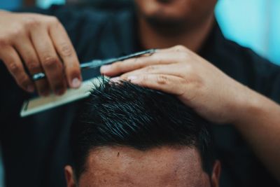 Close-up of man holding hands