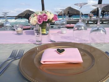 Ice cream in plate on table against sky