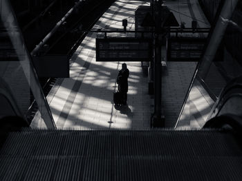 People walking on railroad station platform