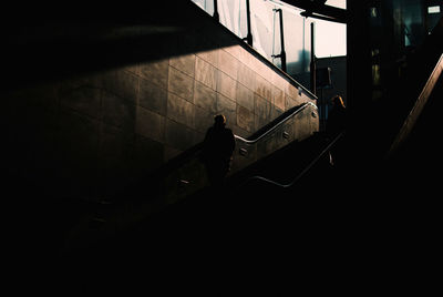 Low angle view of man walking on staircase 