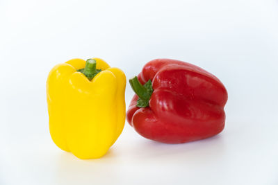 Close-up of bell peppers against white background