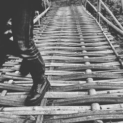 Close-up of woman standing on bench