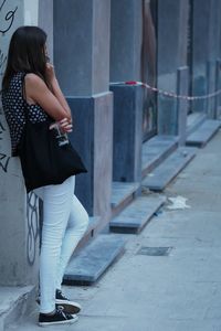 Woman with umbrella in city