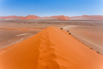 Scenic view of desert against clear sky