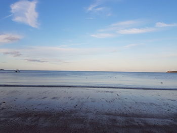 Scenic view of sea against sky at sunset