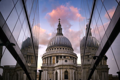 Low angle view of buildings against sky during sunset