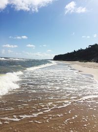 Scenic view of beach against sky