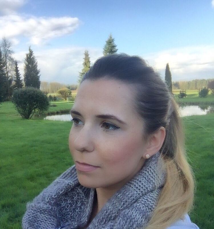 CLOSE-UP PORTRAIT OF YOUNG WOMAN AGAINST TREES