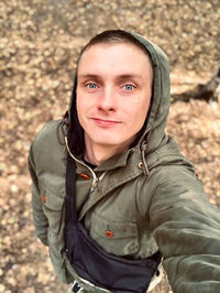 Portrait of mid adult man standing outdoors