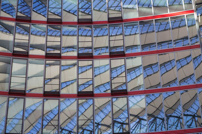 Low angle view of modern building against blue sky