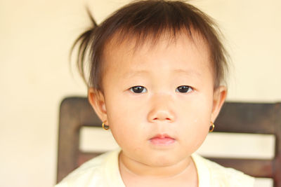 Close-up portrait of cute baby at home