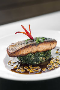 Close-up of fish in plate on table