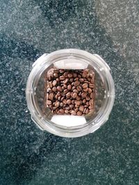 High angle view of coffee in jar on table